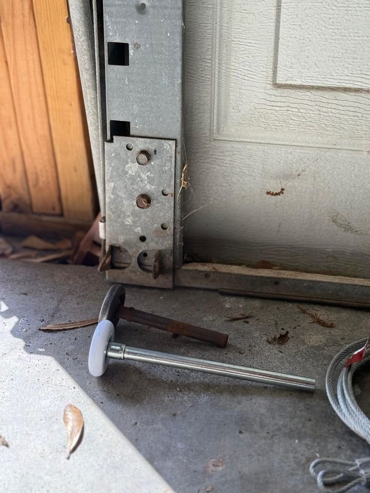 Garage door roller and track service